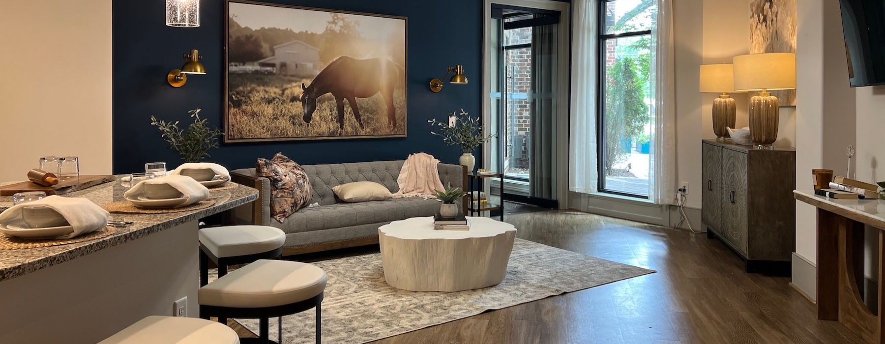 a living room with a couch and a painting