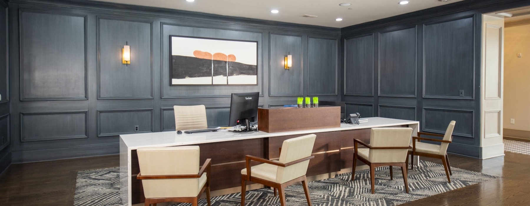 a clubhouse room with a table and chairs