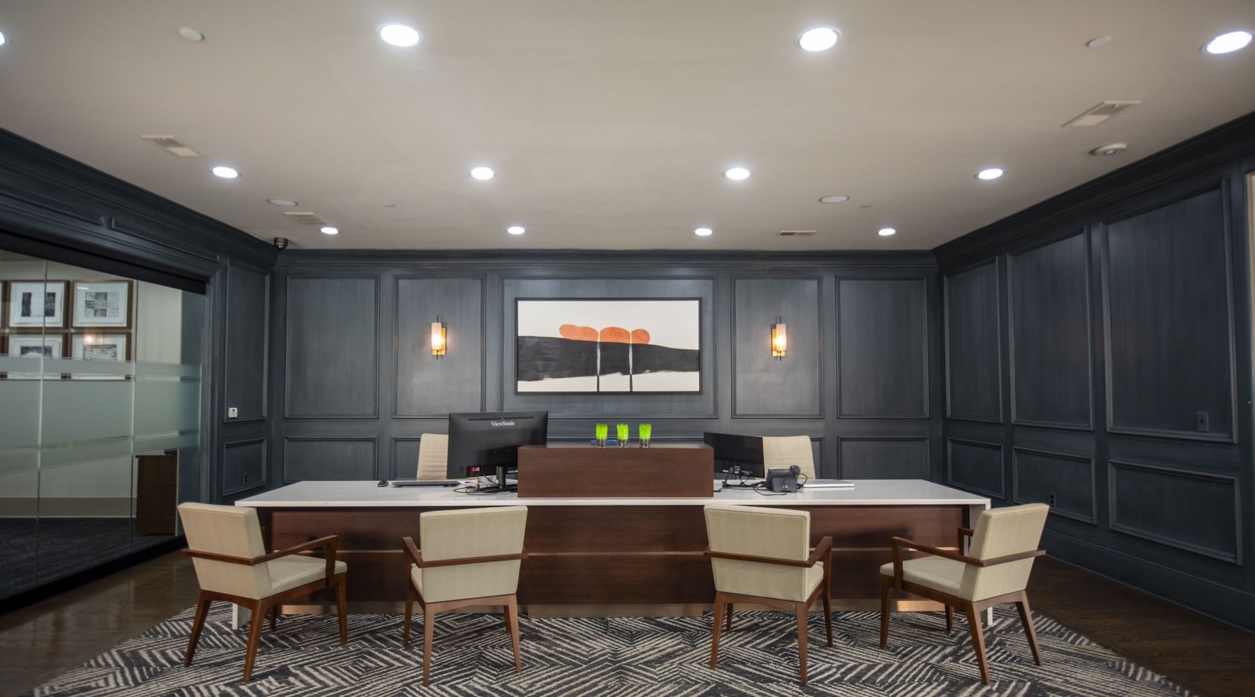 a clubhouse room with a large table and chairs