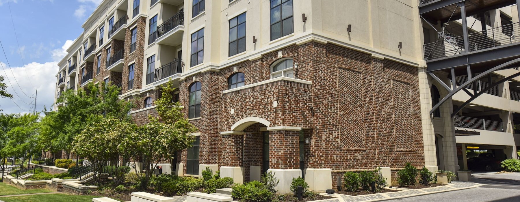 a building with trees and grass