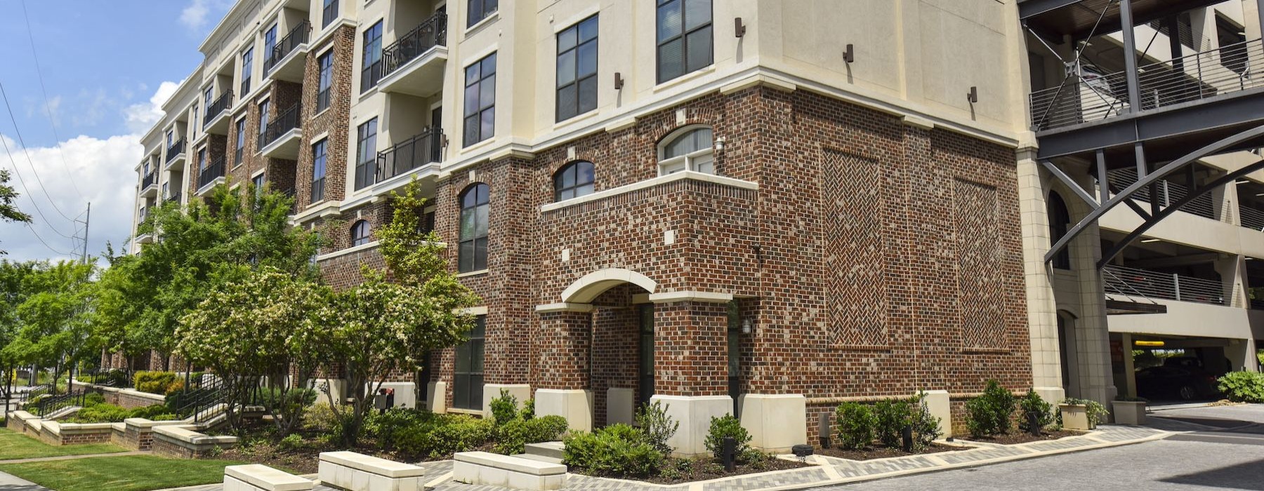 a building with trees and grass