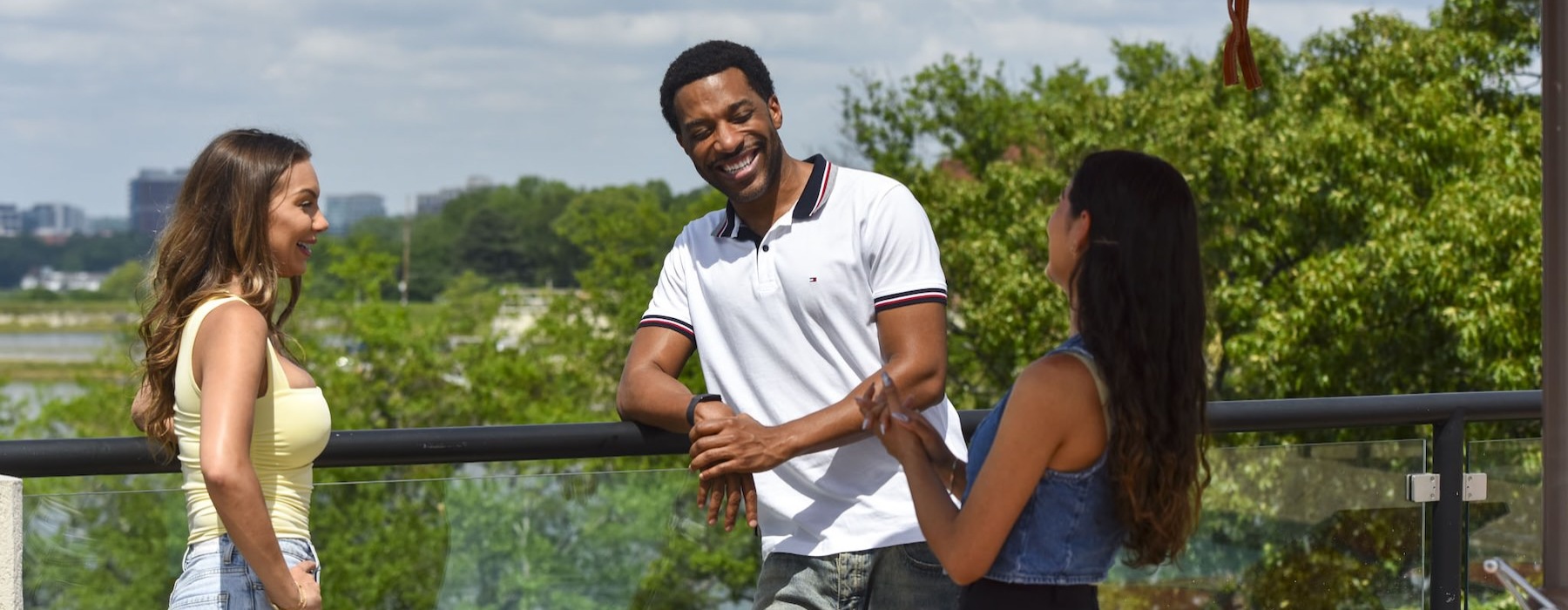 people laughing together with trees in the background