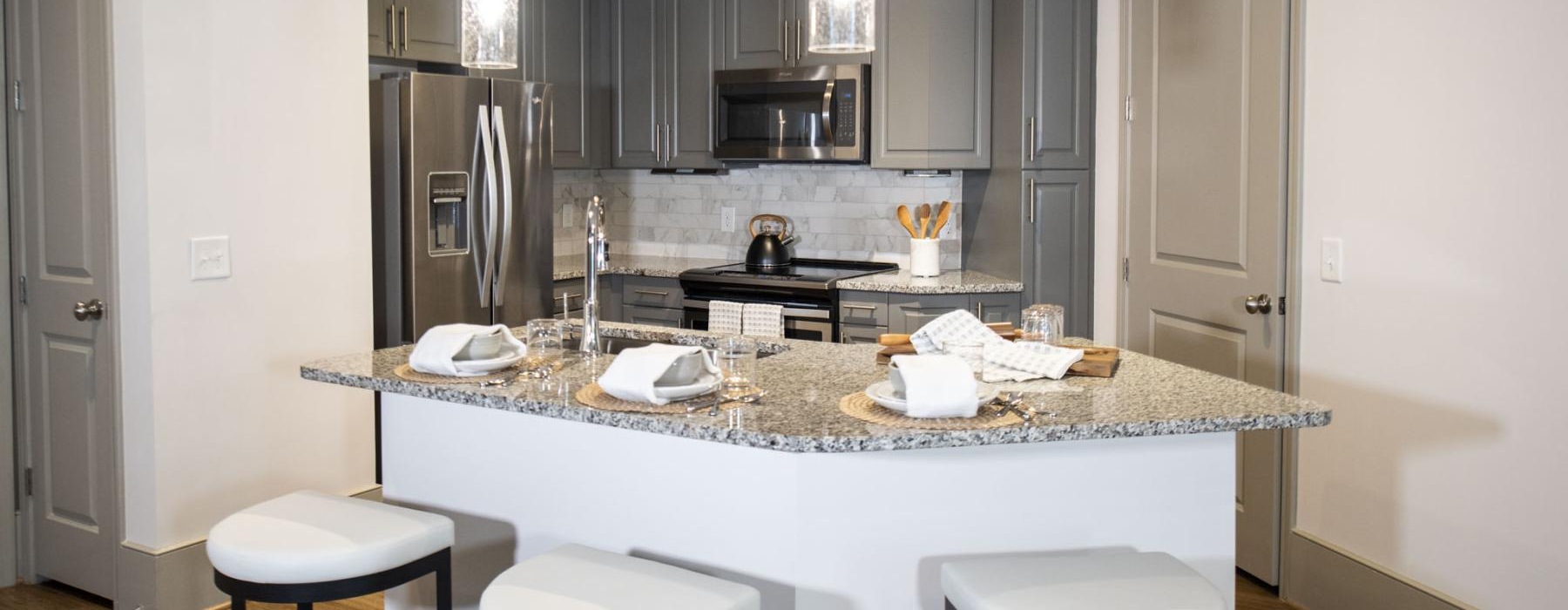 a kitchen with a marble countertop